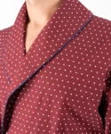 Lapel fabric detail of model wearing tom dick and harry burgundy polka dot dressing gown