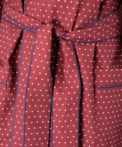 Belt fabric navy piping detail of model wearing tom dick and harry burgundy polka dot dressing gown