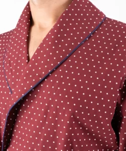 Lapel fabric detail of model wearing tom dick and harry burgundy polka dot dressing gown
