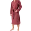 Front view of model wearing tom dick and harry burgundy polka dot dressing gown