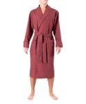 Straight on view of model wearing tom dick and harry burgundy polka dot dressing gown