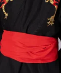 Detail of a red obi belt on a black flare dragon male yukata kimono robe