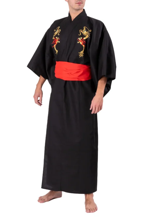 Model wearing a black flare dragon male yukata kimono robe with a red obi belt