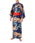 Front view of a model wearing a gold dragon and eagle navy yukata kimono with optional red obi belt