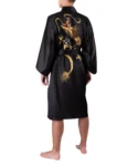 Back view of model wearing a rising dragon black kimono