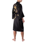 Side view of model wearing a rising dragon black kimono