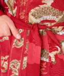 Fabric detail of red dragon and fuji kimono