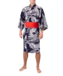 Front view of model wearing a navy carp happi Japanese kimono with the optional red obi belt