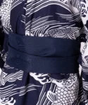 Detail of navy obi belt on a navy carp male yukata kimono robe