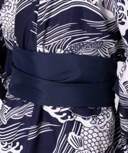 Detail of navy obi belt on a navy carp male yukata kimono robe