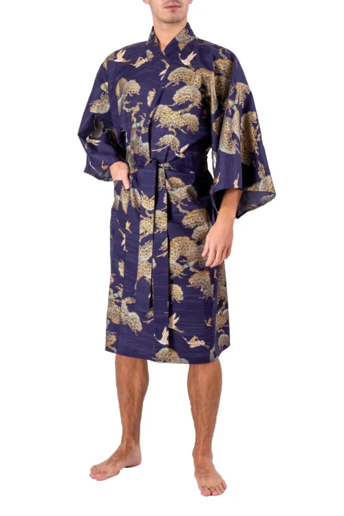 Front view of model wearing a navy pine and crane men's happi kimono