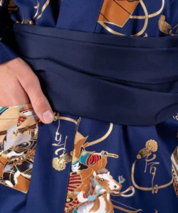 Fabric detail of navy obi belt with navy samurai warrior happi kimono